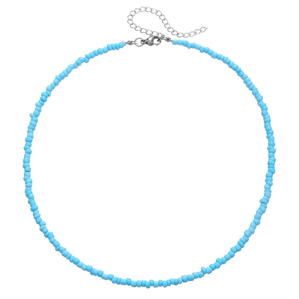Collana con ciondolo a margherita minimalista con accenti di turchese e perle su catena a maglia per donna