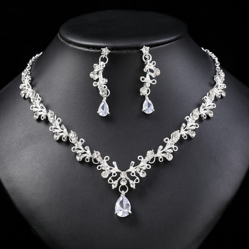 Set di collana e orecchini in lega dolce e fresca con ciondolo in cristallo a forma di campana a goccia a cuore, finitura placcata per donna