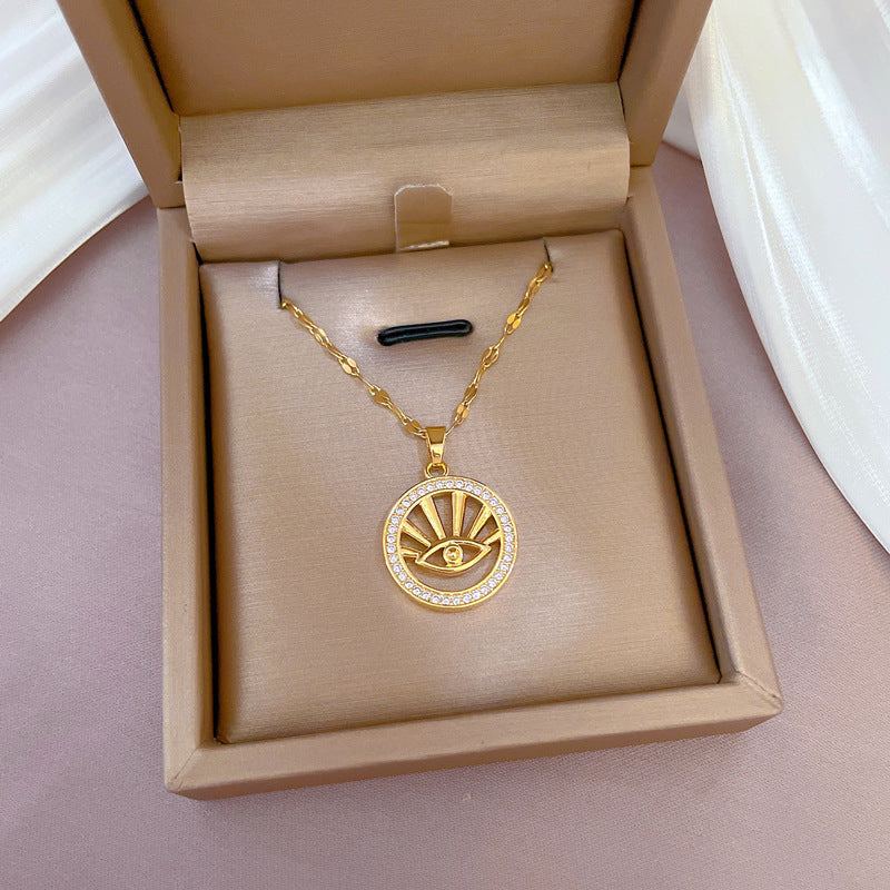 Collana Minimalista Geometrica in Acciaio al Titanio con Ciondolo Occhio di Allah in Zirconia Micro-Incastonata e Dettaglio in Rame Placcato Oro