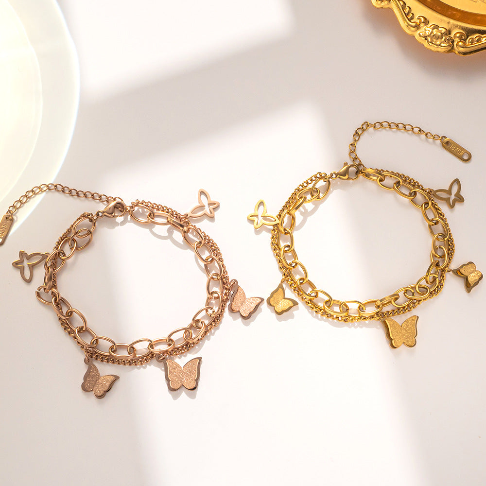 Bracciale a doppia farfalla in acciaio al titanio placcato oro rosa da donna con design geometrico e stile minimalista alla moda