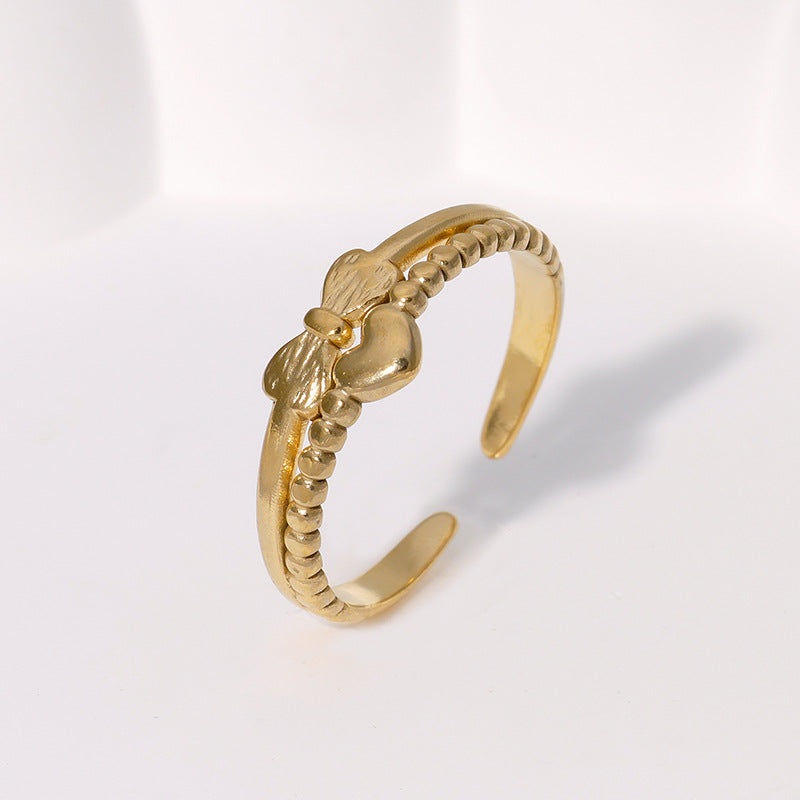 Anello regolabile da donna in acciaio inossidabile con fiocco a forma di cuore minimalista e finitura placcata