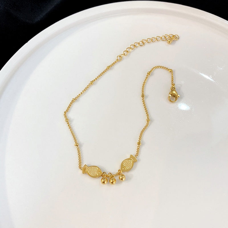 Cavigliera Minimalista Geometrica a Forma di Pesce da Donna con Perline Rotonde e Finitura di Pregio