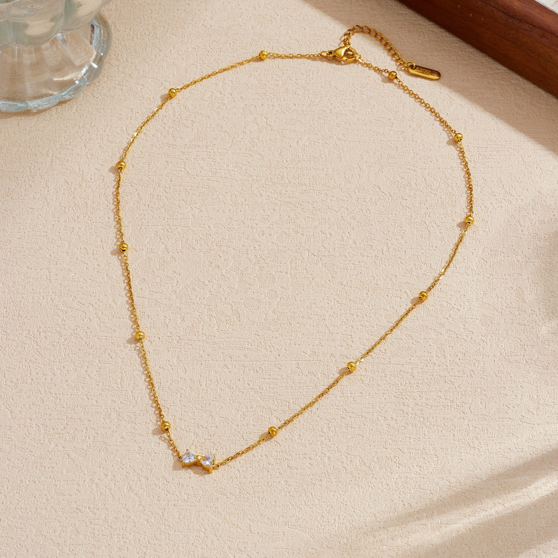 Minimalist Gold Plated Stainless Steel Bow Knot Necklace with Cubic Zirconia for Women