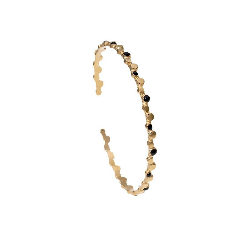Bracciale rigido aperto in acciaio inossidabile placcato oro 18K con pois geometrici minimalisti alla moda