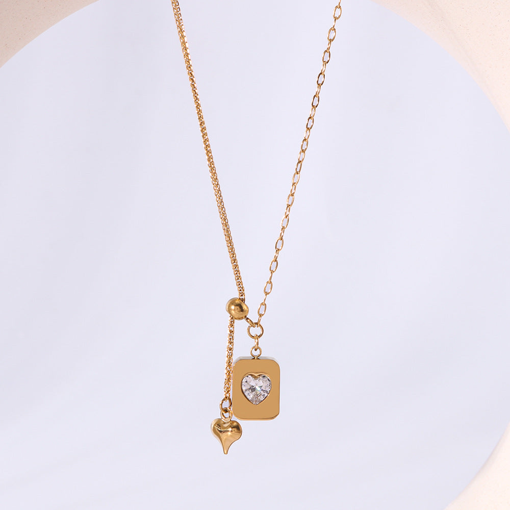 Collana con Pendente a Cuore Minimalista in Acciaio al Titanio con Intarsio in Zirconia Cubica e Placcatura in Oro 18K su Catena O per Donna