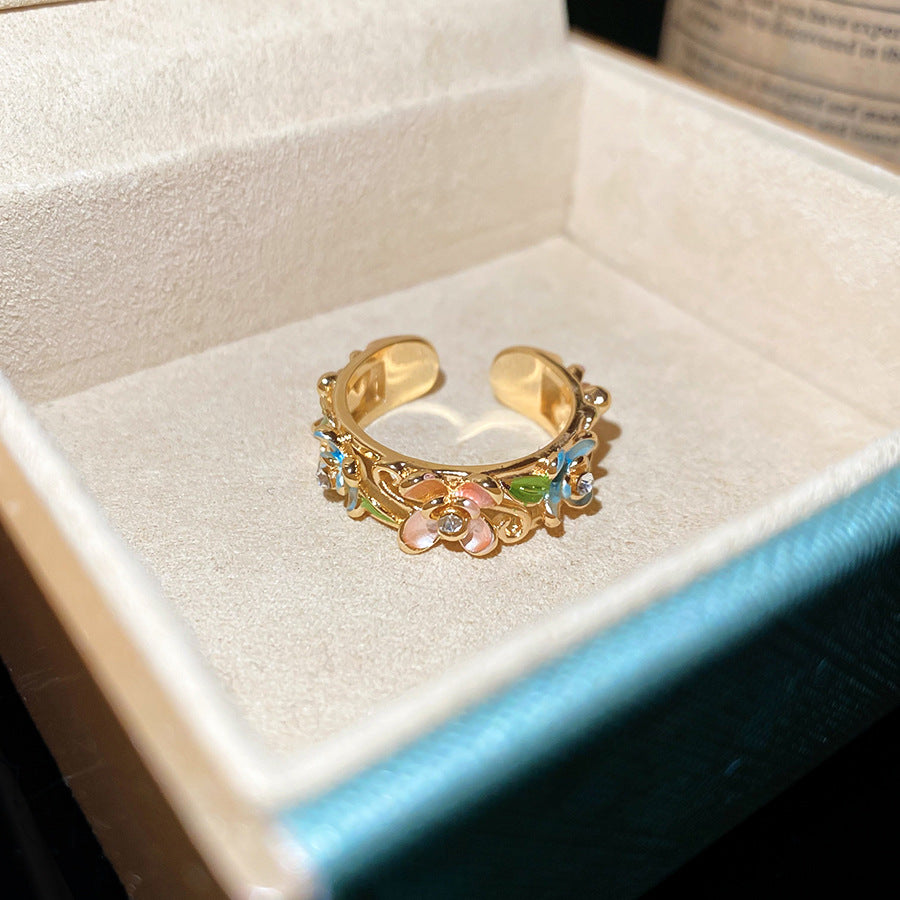 Anello floreale elegante con finitura smaltata e intarsio di strass da donna, fascia per l'indice di alta moda ispirata al vintage