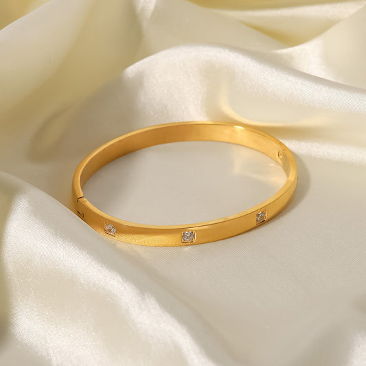 Pulsera de Acero Titanio Geométrica Minimalista para Mujer con Baño de Oro de 18K e Incrustación de Circones Blancos Redondos