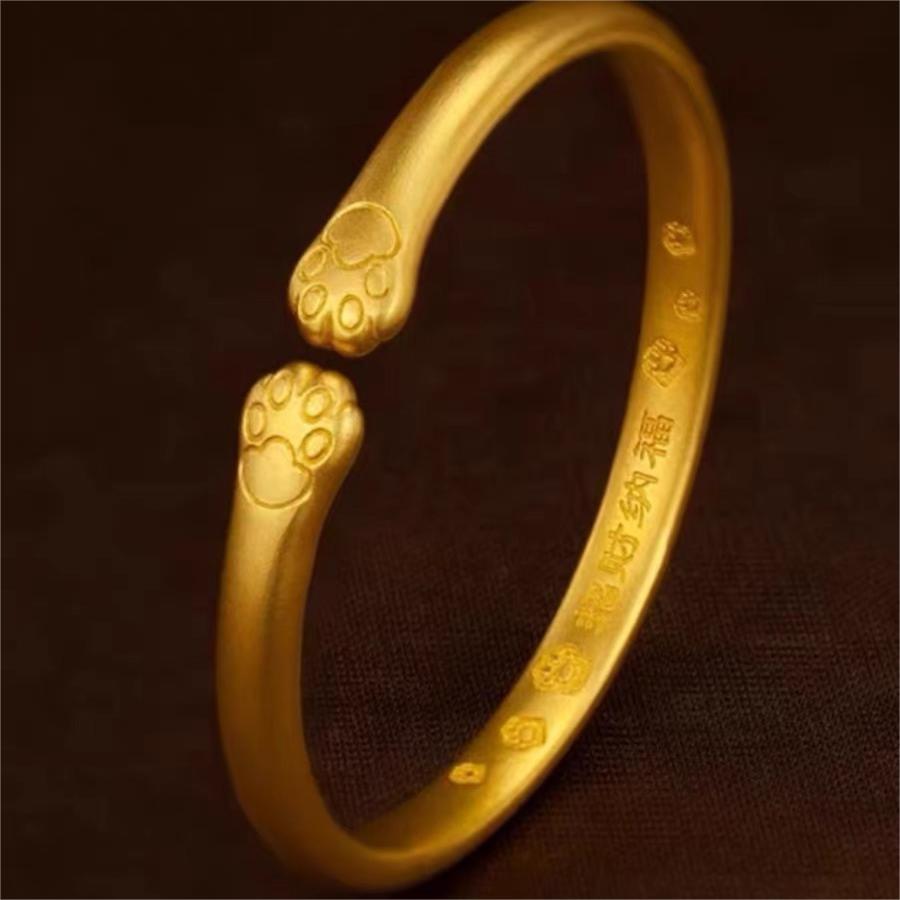 Bracciale a forma di zampa di gatto carino in rame placcato oro per donna con design delicato ed elegante