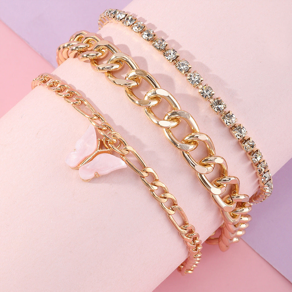 Pulsera de aleación con forma de mariposa estilo punk con incrustaciones de diamantes de imitación y acabado esmaltado para mujer