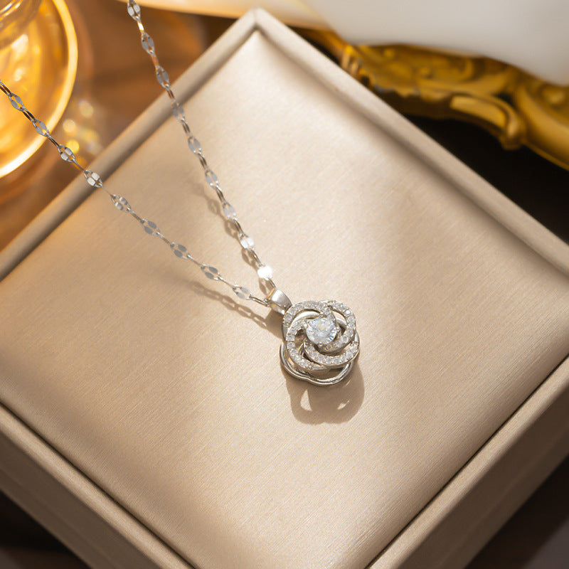 Light Luxury Geometric Camellia Pendant Necklace for Women with Rotating Zirconia Accents in Titanium Steel with Water Wave Chain