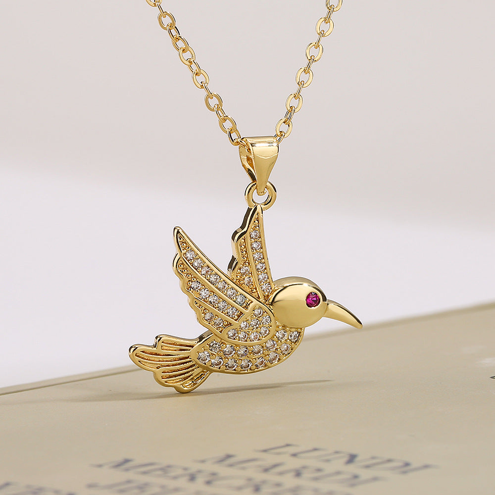 Collana con ciondolo a forma di uccello minimalista in rame placcato oro con zirconi per donna