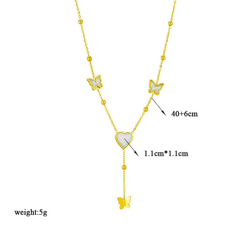 Collar con colgante minimalista de corazón y mariposa con borlas de acero titanio con acabado chapado para mujer
