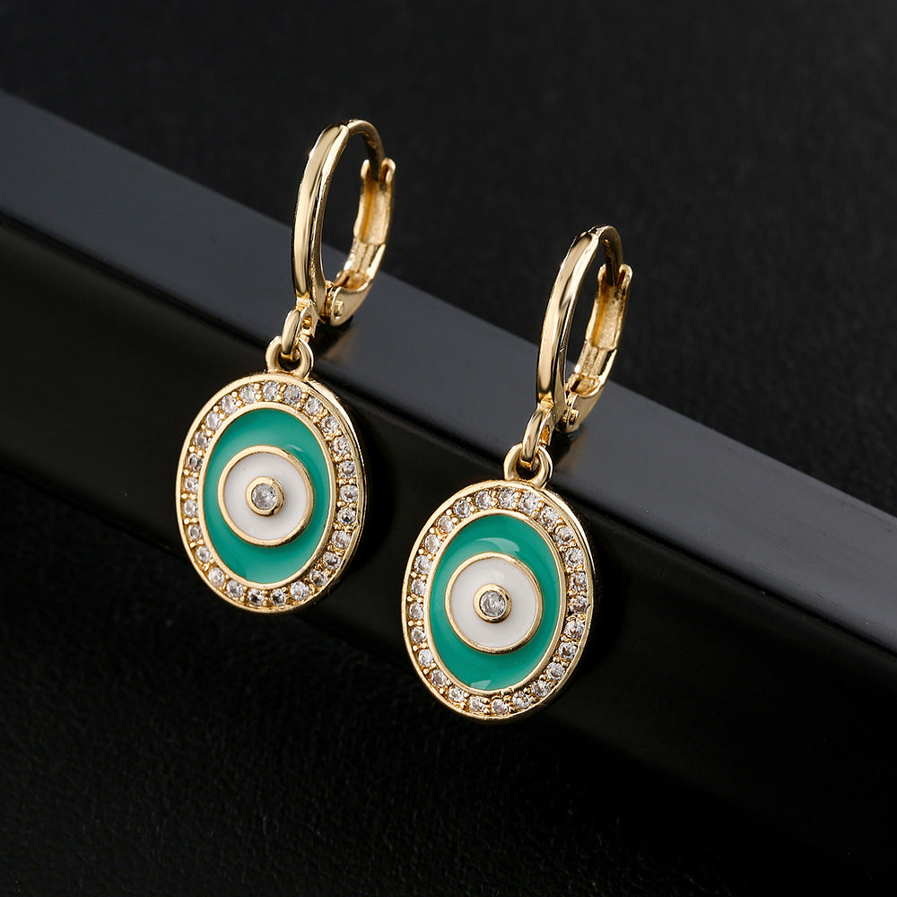 Orecchini geometrici in rame a forma di occhio con placcatura in oro 18 carati e accenti in zirconia smaltata colorata