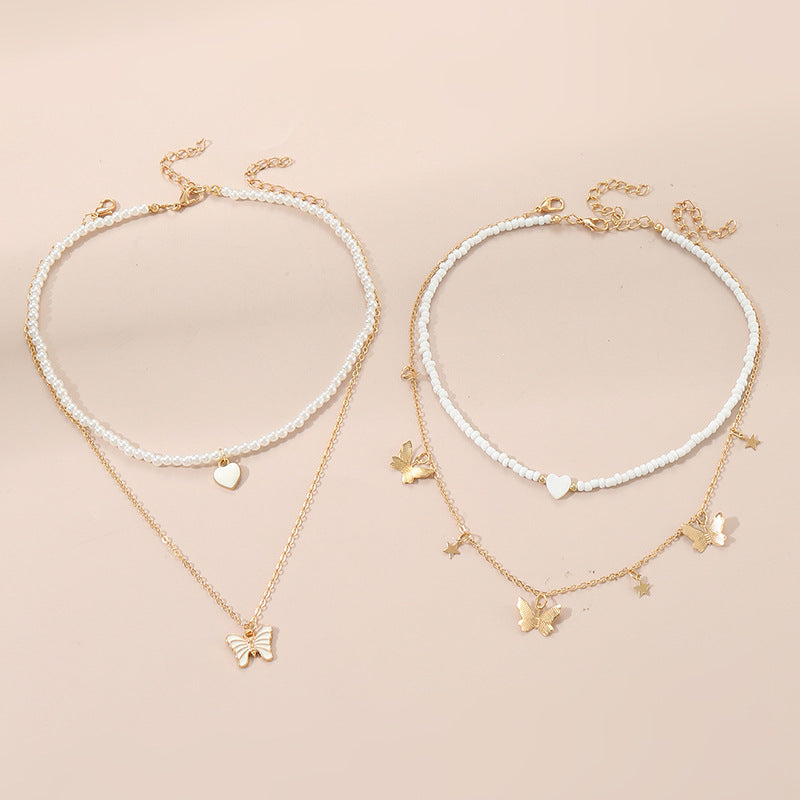Bonito collar con dije de aleación esmaltado en forma de corazón para niños con cadena de eslabones torcidos