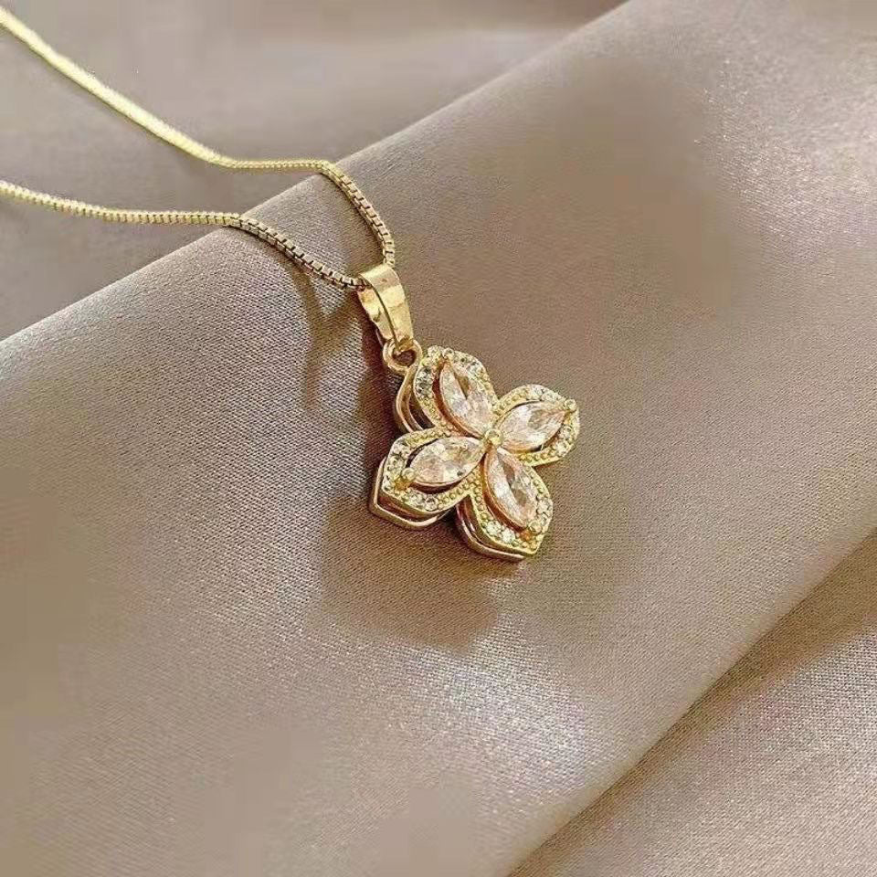 Minimalist Rotating Flower Pendant Necklace in Titanium Steel with Gold Plating and Cubic Zirconia Accents for Women