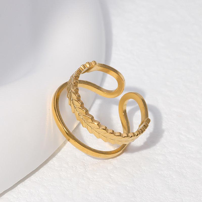 Anello aperto in acciaio inossidabile a forma di foglia minimalista da donna con finitura placcata