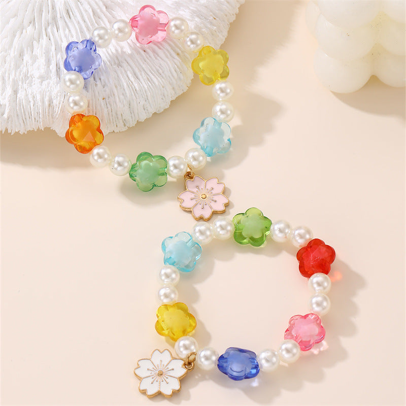 Bracciale per Bambine con Ciondolo a Cuore Floreale e Arcobaleno in Resina Plastica con Perline e Stella