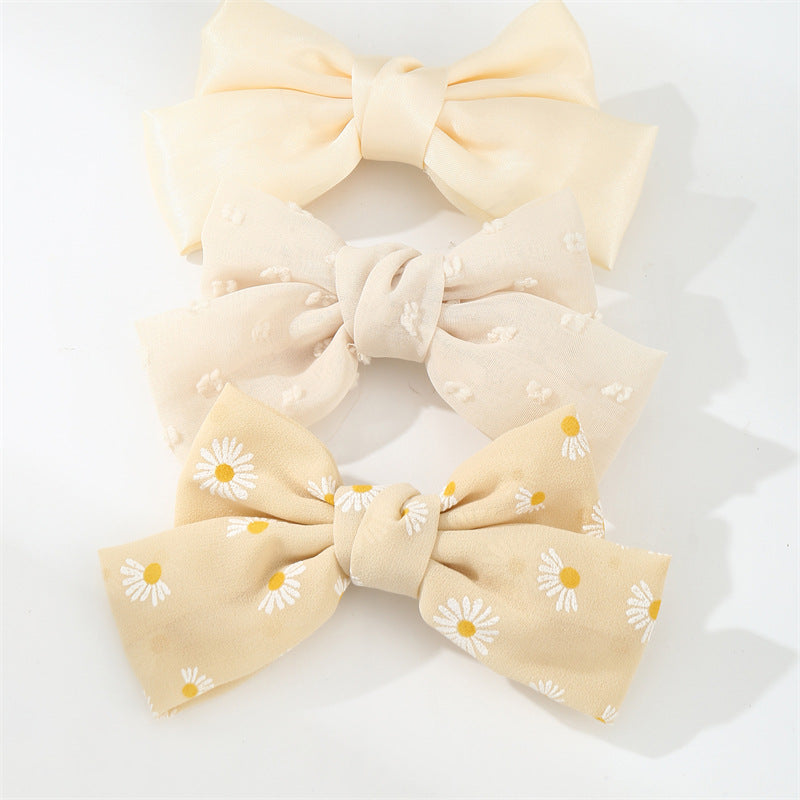 Set di fermagli per capelli minimalisti con fiocco a margherita per bambini in tessuto con palette di colori macaron e texture a maglia