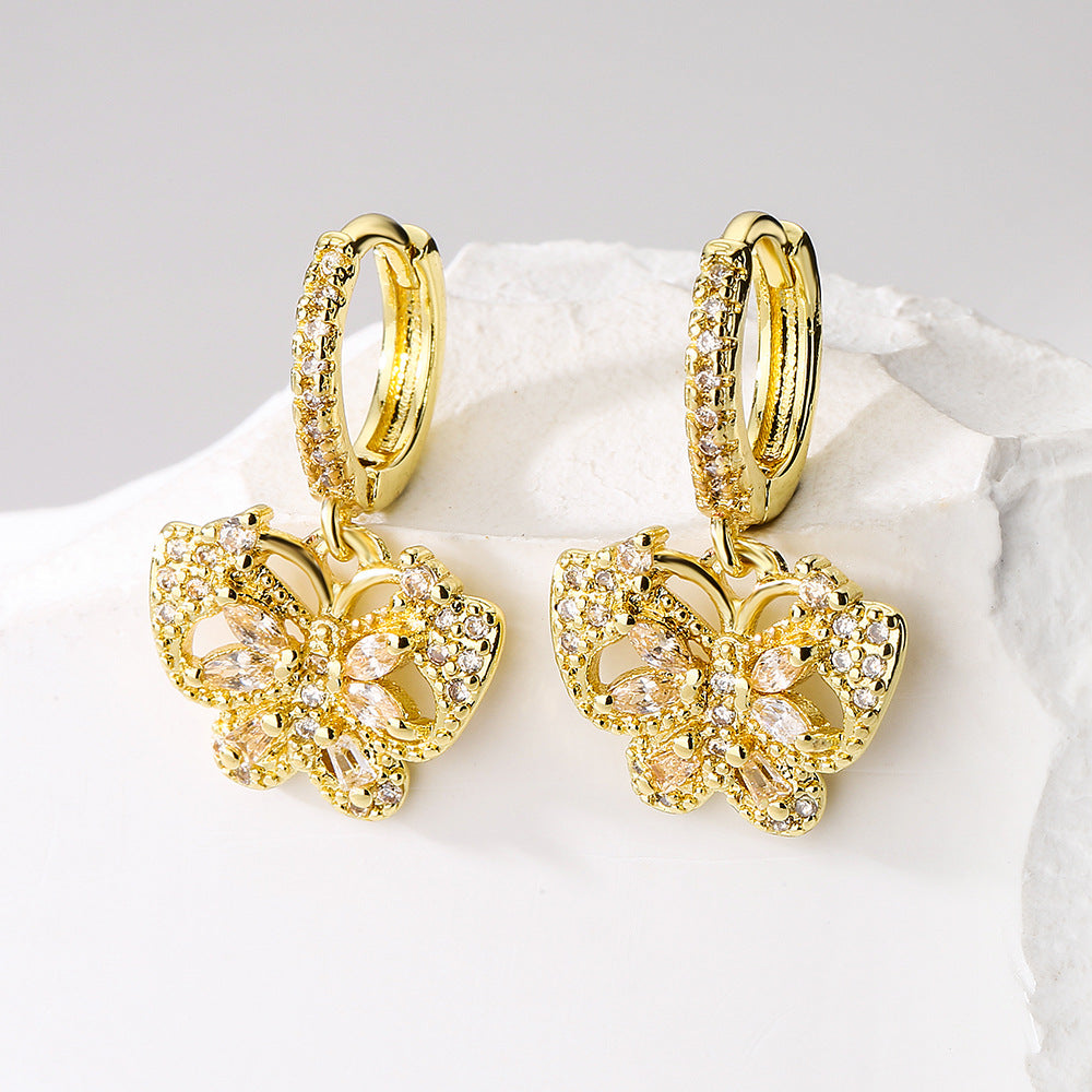 Orecchini a farfalla alla moda in rame placcati oro 18 carati con intarsio di zirconi per donna