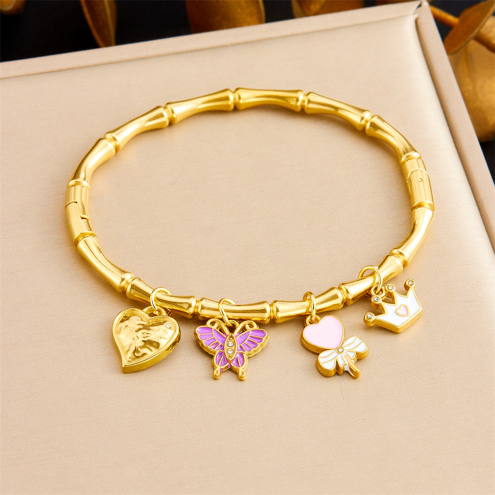 Bracciale Minimalista in Acciaio Inossidabile Placcato Oro a Tema Oceano Tropicale con Motivi di Stella Marina, Conchiglia e Farfalla