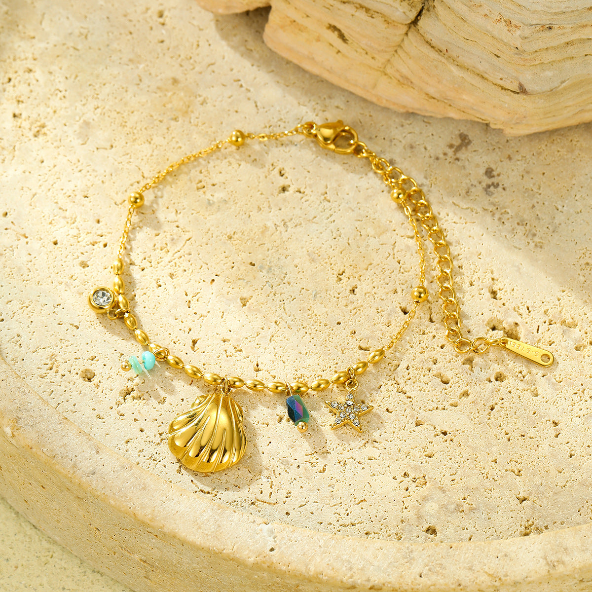 Fashionable Ocean-Inspired Shell and Star-Shaped Titanium Steel Bracelet with Zircon Inlay and 18K Gold Plating for Women