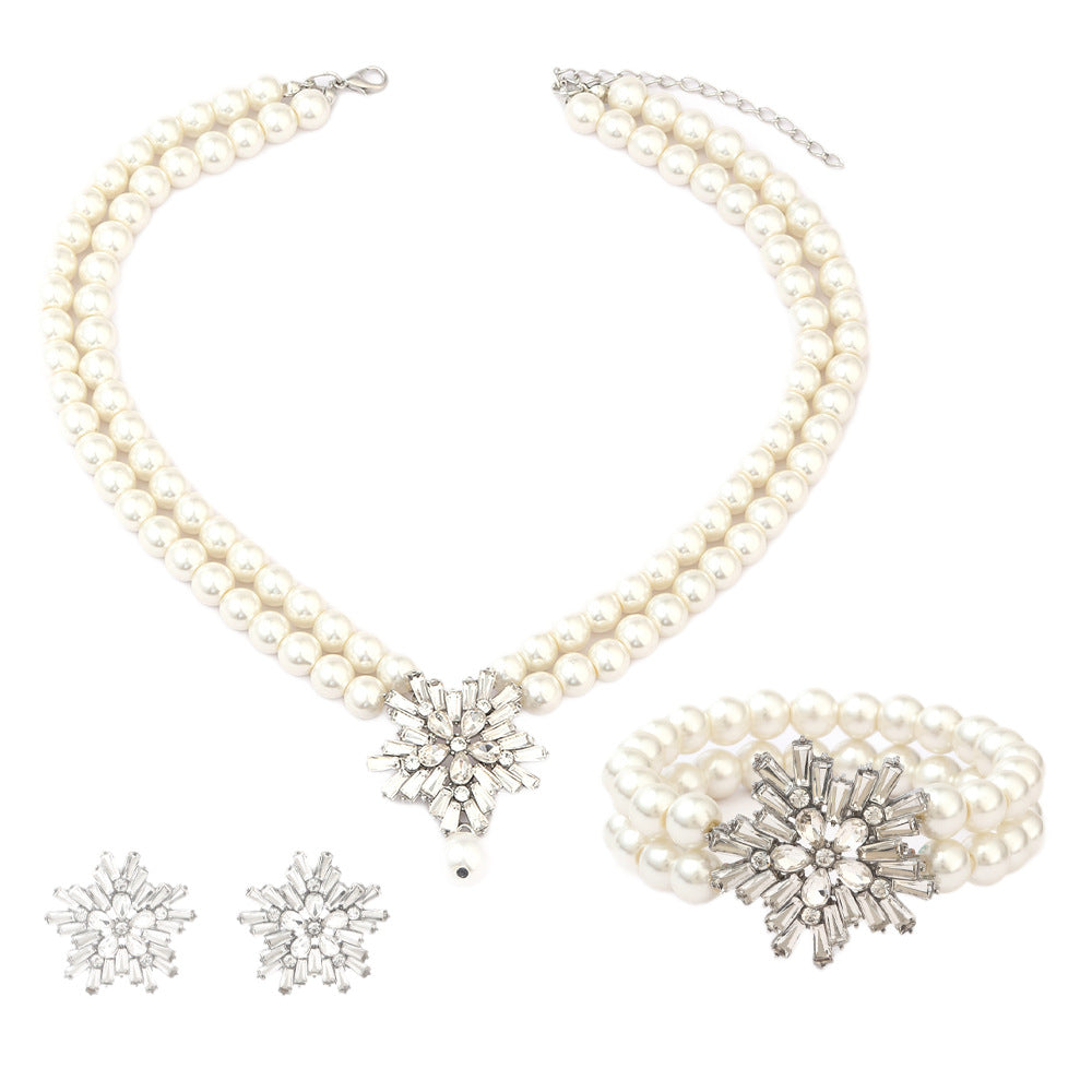 Original Design Snowflake Pendant Set with Imitation Pearl Necklace, Rhinestone Earrings, and Pearl Bracelet for Women