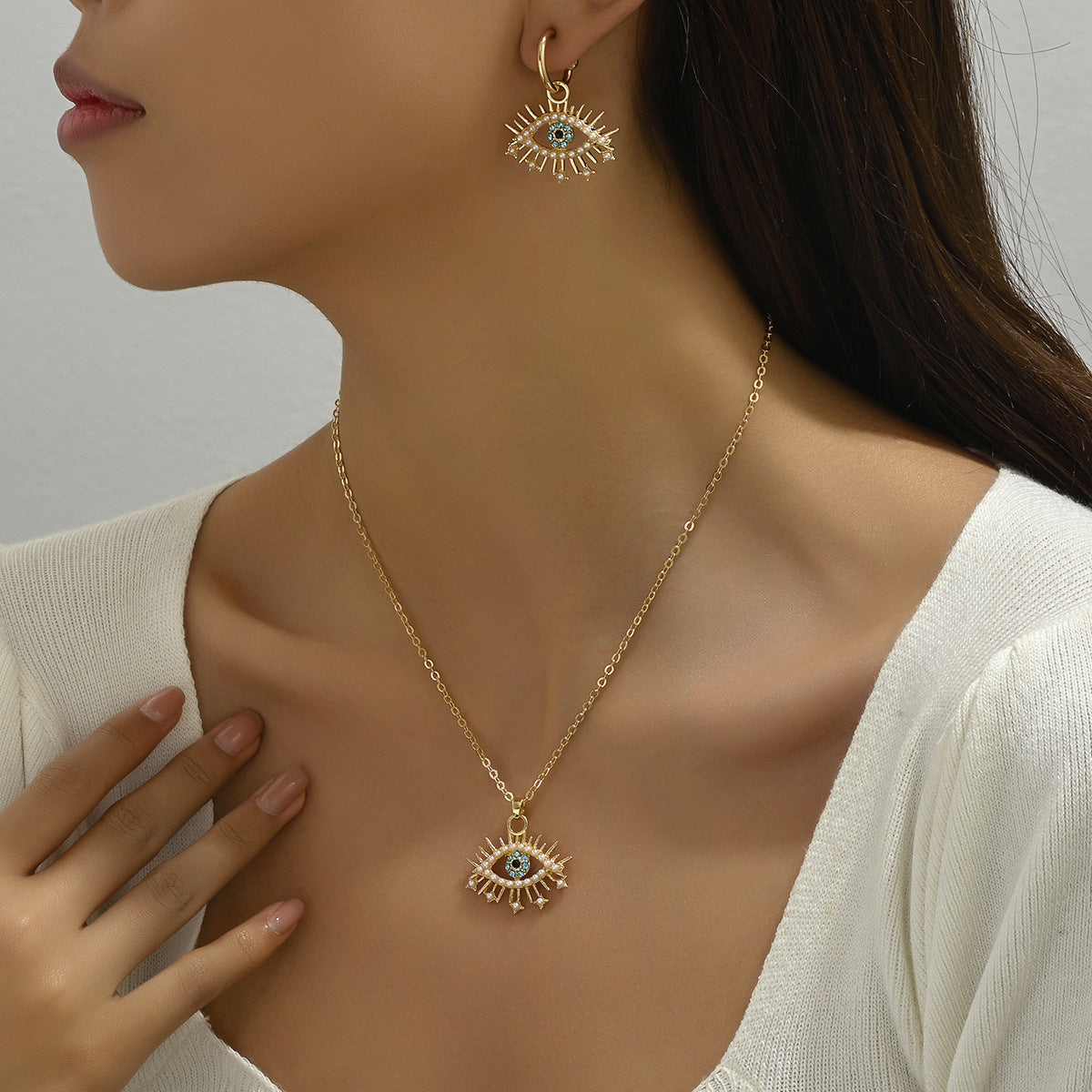 Conjunto de collar con colgante minimalista de ojo de ángel con incrustaciones de pedrería en aleación para mujer, cadena larga de clavícula y pendientes a juego