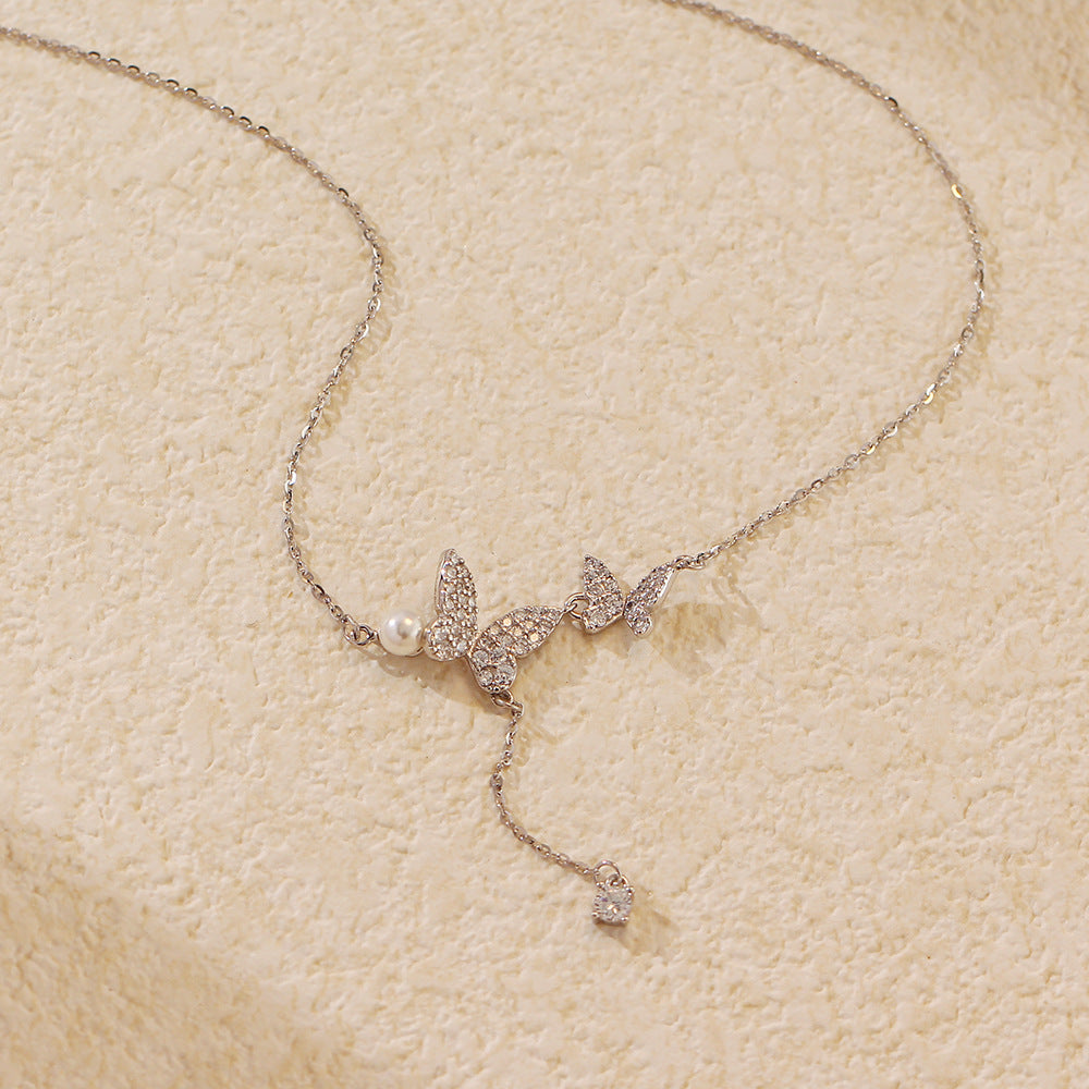 Elegante collana a farfalla in argento sterling 925 con zirconi cubici e nappe di perle a catena forzata da donna