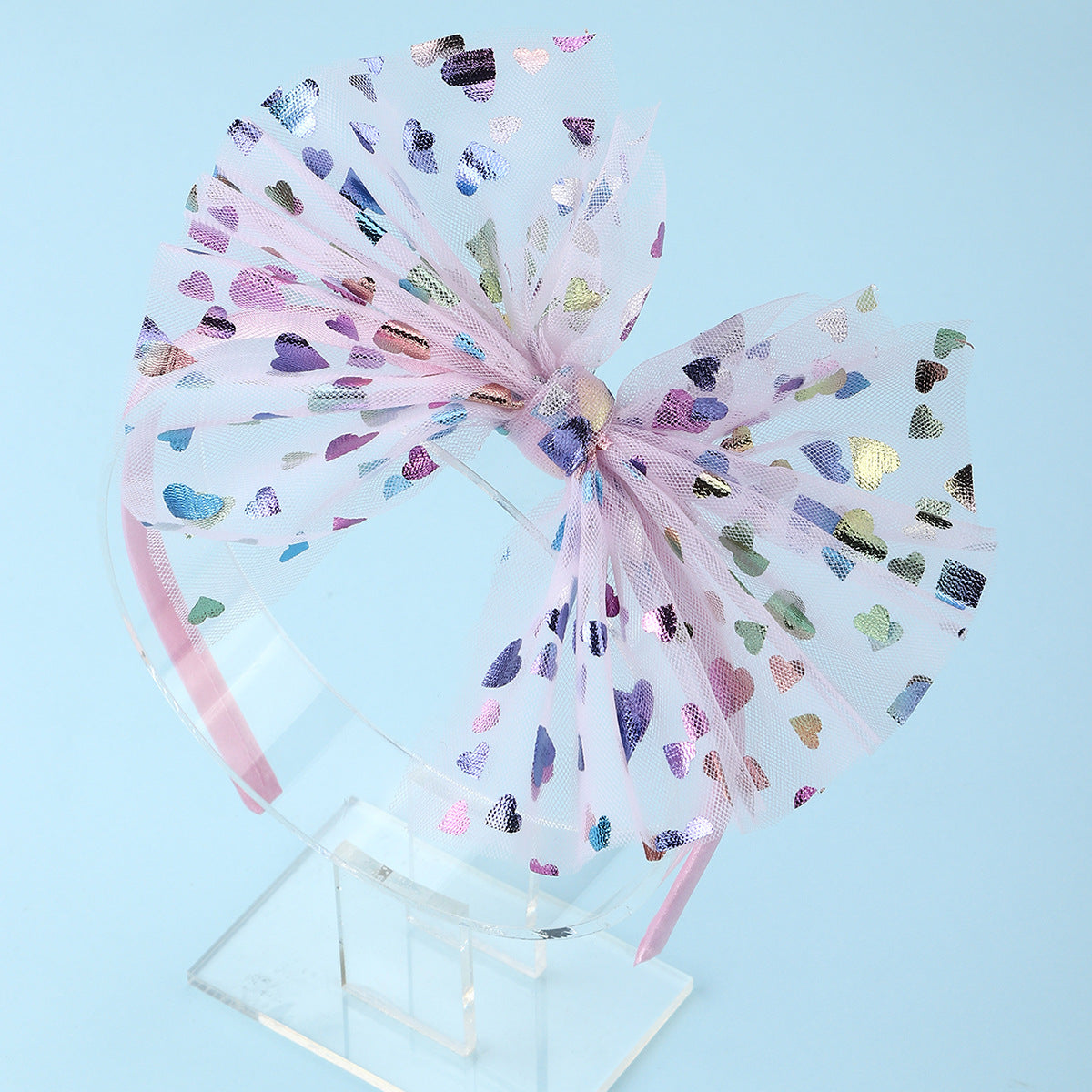 Fascia per capelli con fiocco grande colorata e minimalista, con dettagli arricciati e abbellimenti in perle per bambini