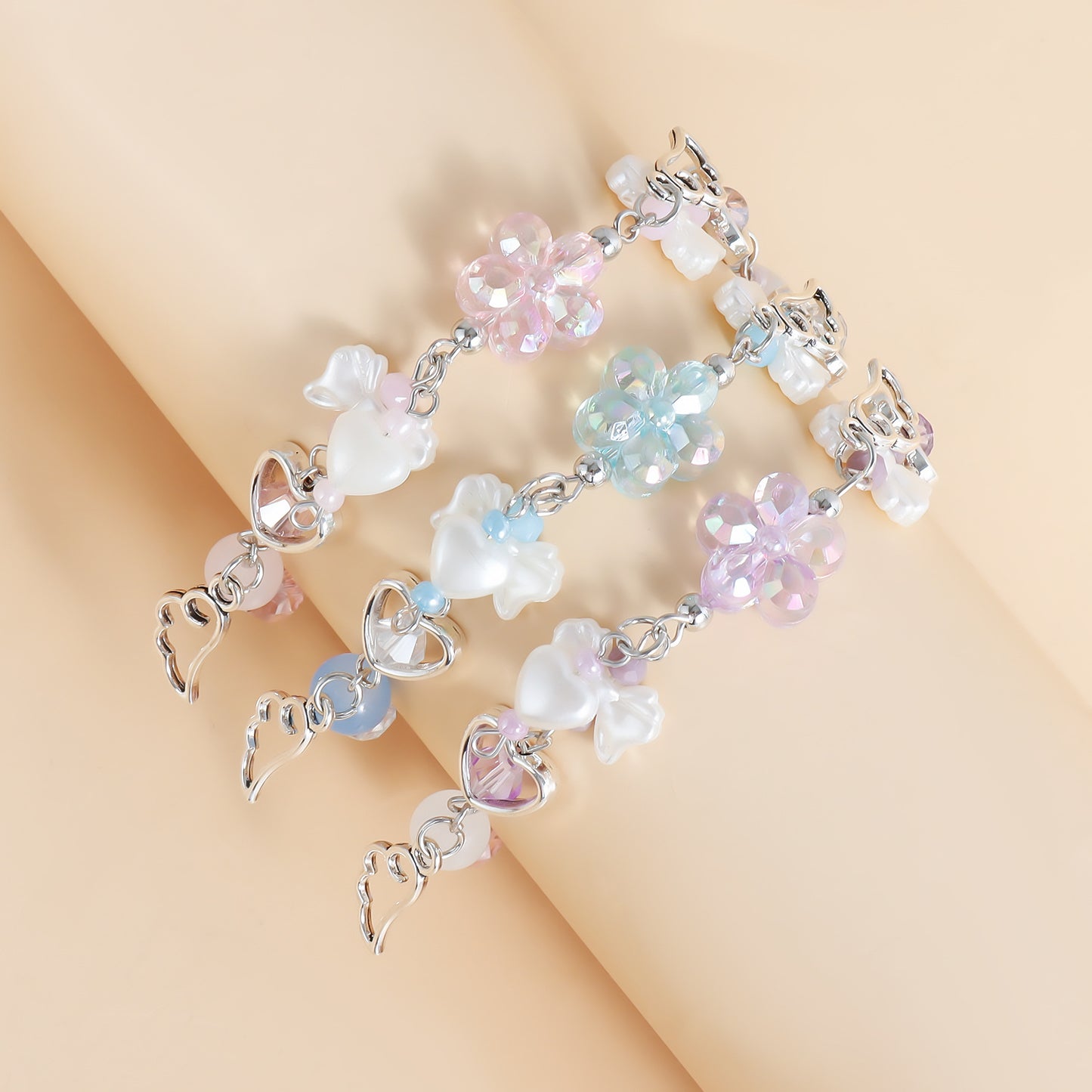 Minimalist Geometric Pendant Handmade Beaded Bracelet for Women with Electroplated Metal Finish and Iridescent Tassel Accents