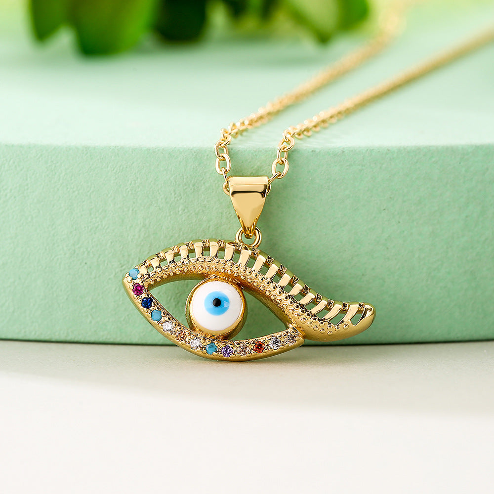 Collana con pendente a occhio blu geometrico minimalista da donna con base in rame e placcatura in vero oro con accenti di zirconi