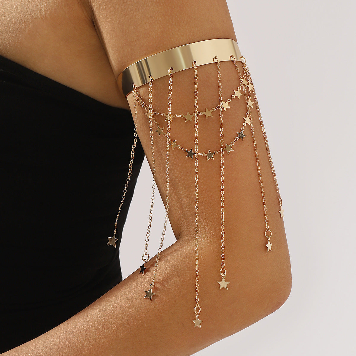 Pulsera ajustable vintage en forma de estrella con detalle de borla en hierro galvanizado