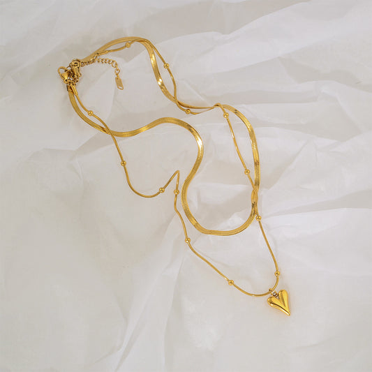 Collana con ciondolo a cuore doppio strato minimalista in acciaio inossidabile con finitura placcata per donna e uomo