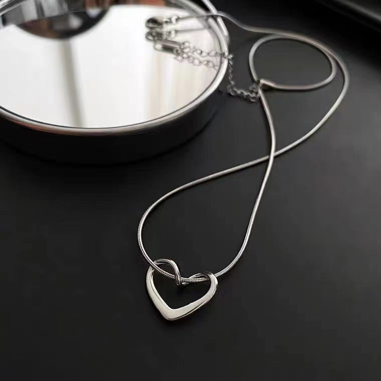Minimalist French Style Hollow Heart Titanium Steel Clavicle Necklace for Women with Gold Plating and Snake Chain
