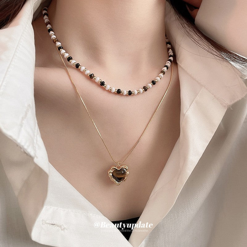 Collana pendente occhio di tigre in stile retrò con design geometrico da donna, catena a maglie color oro, accessorio minimalista di lusso