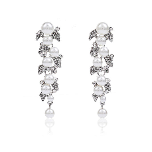Pendientes minimalistas de aleación con forma de hoja y acabado chapado para mujer, diseño elegante con gota de perla, joyería de moda