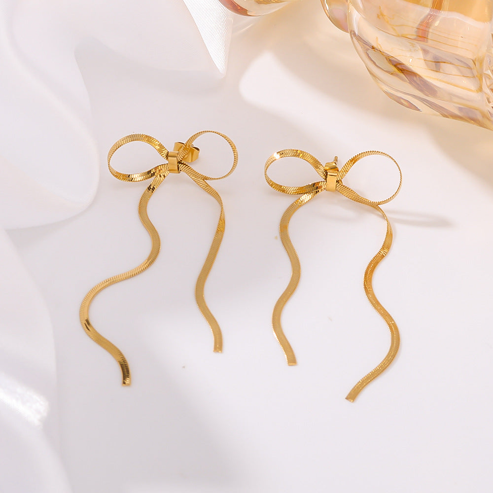 Fashion Bow-Shaped Tassel Long Earrings in Stainless Steel with 18K Gold Plated Snake Chain for Women