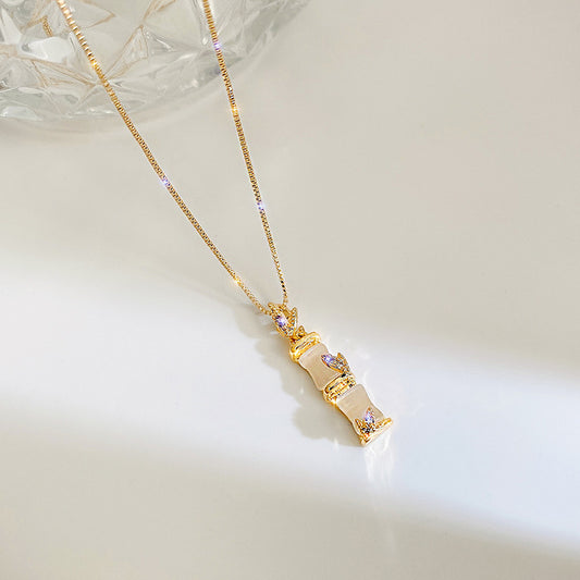 Collana con ciondolo minimalista in bambù per donna con catena a scatola in acciaio al titanio a forma di foglia, placcata sottovuoto, catena per il collo leggera di lusso
