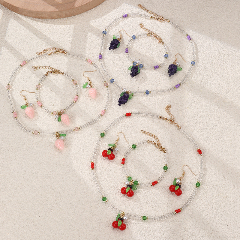 Set collana e braccialetto in lega con fiocco minimalista per ragazze con ciondoli a forma di ciliegia, uva, frutta e stella marina