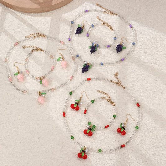 Juego de collar y pulsera minimalistas de aleación con lazo para niñas, con dijes de cereza, uva, fruta y estrella de mar