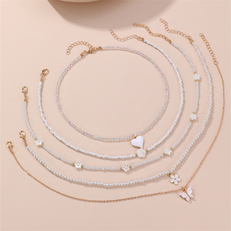 Simpatica collana per bambini con perline di vetro a forma di fiocco e ciondolo in lega su catena di perline rotonde per bambini dai 3 ai 10 anni