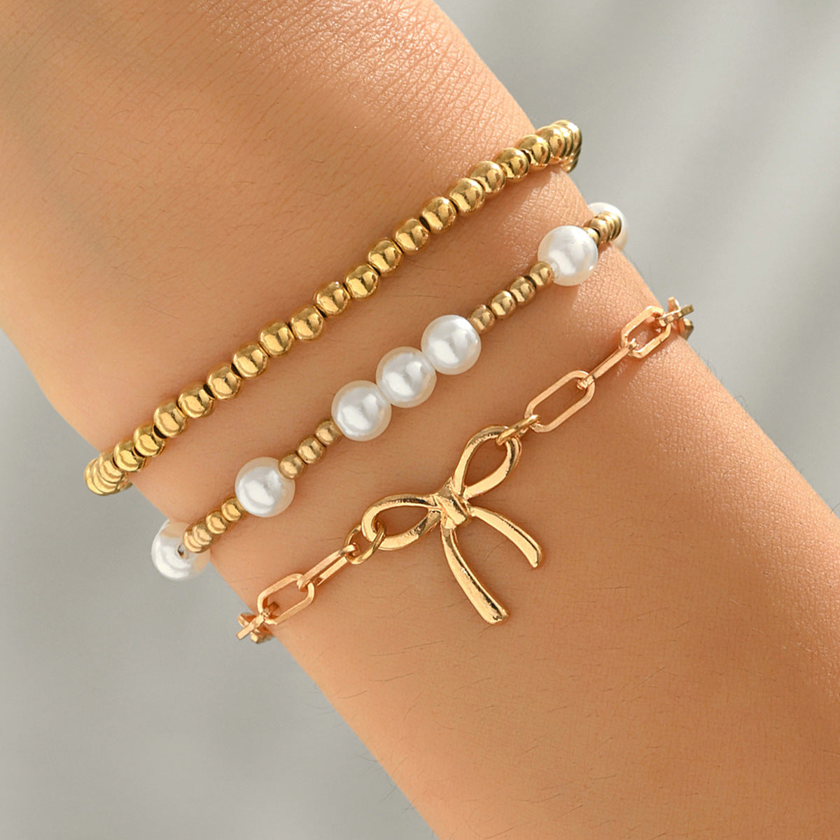 Conjunto de pulseras de aleación geométrica en forma de lazo estilo Fashion-Commuter con detalles de perlas tejidas para mujer