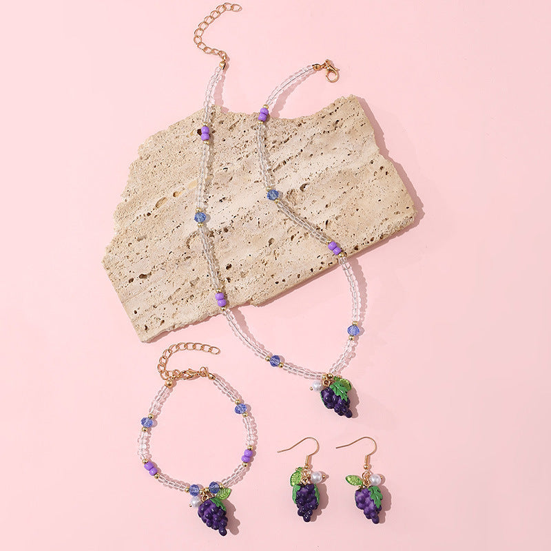 Set di collane con ciondoli a forma di fiocco, ciliegia, uva, frutta e stella marina in resina per bambine con catena di perline
