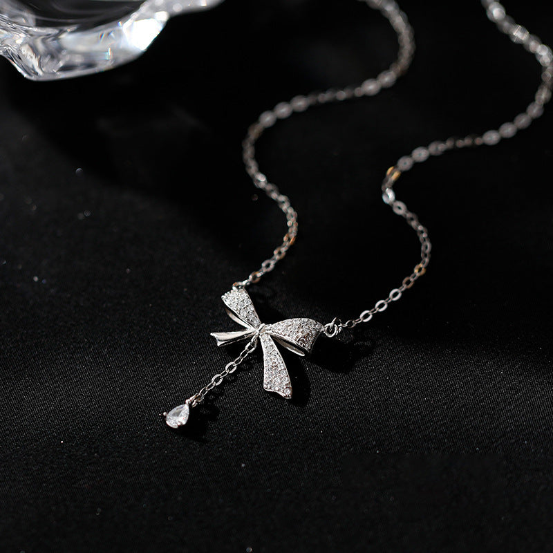 Minimalist Bow-Shaped Titanium Steel Pendant Necklace for Women with Plated Finish and Delicate Layered Look