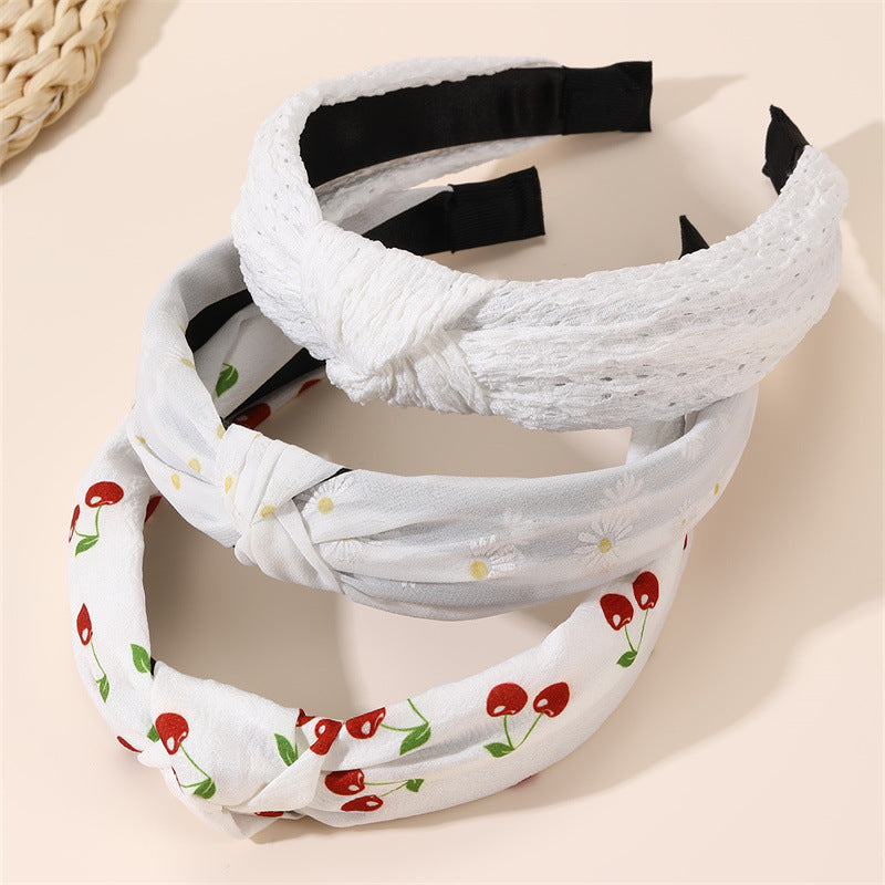 Diadema de tela ancha con estampado floral dulce para niñas con ribete de encaje y diseño geométrico