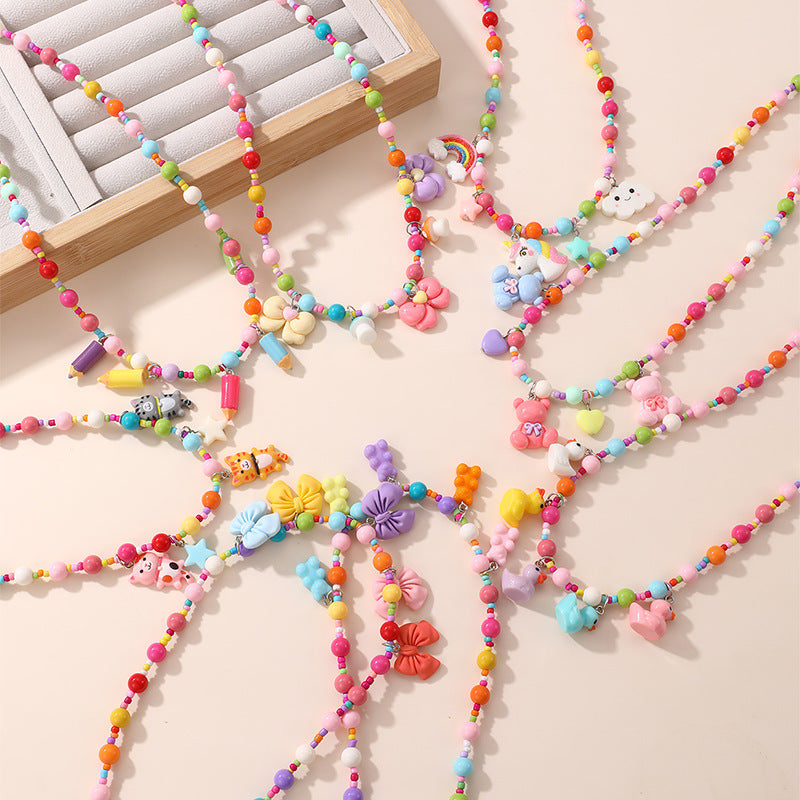 Collana con ciondolo a fiocco dolce pastello per ragazze con ciondolo in resina su catena a O, gioielli in stile cartone animato