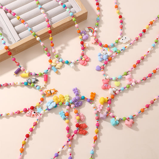 Collana con ciondolo a fiocco dolce pastello per ragazze con ciondolo in resina su catena a O, gioielli in stile cartone animato