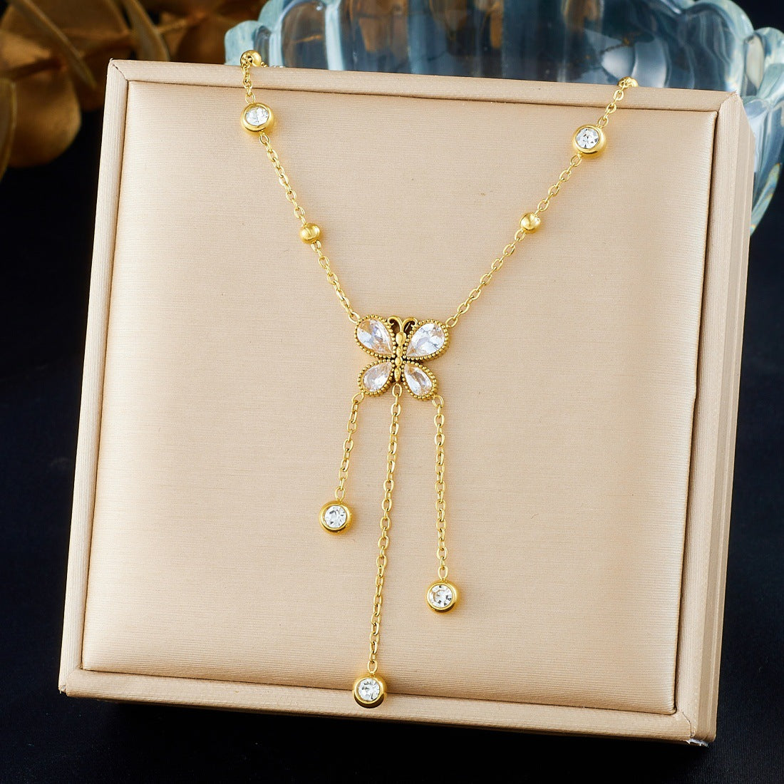 Minimalist Gold Plated Stainless Steel Butterfly Teardrop Pendant Necklace with Rhinestone Inlay and Tassel Chain for Women