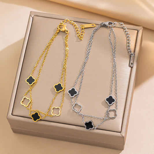 Pulsera para mujer de acero de titanio chapado en oro de 18 quilates, con diseño de doble capa hueca de trébol de cuatro hojas