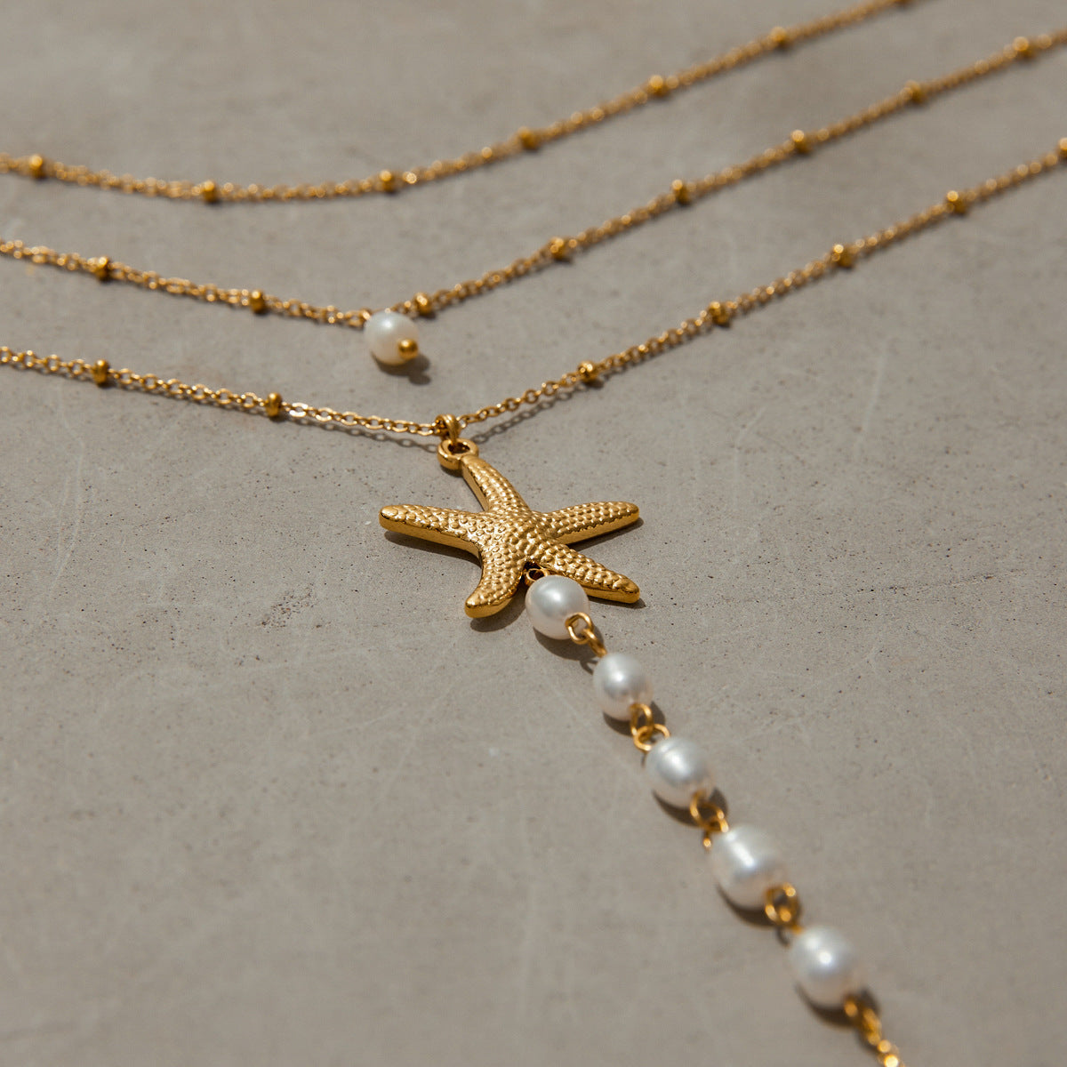 Elegant Stainless Steel Starfish Pendant Necklace with Pearl Inlay for Women